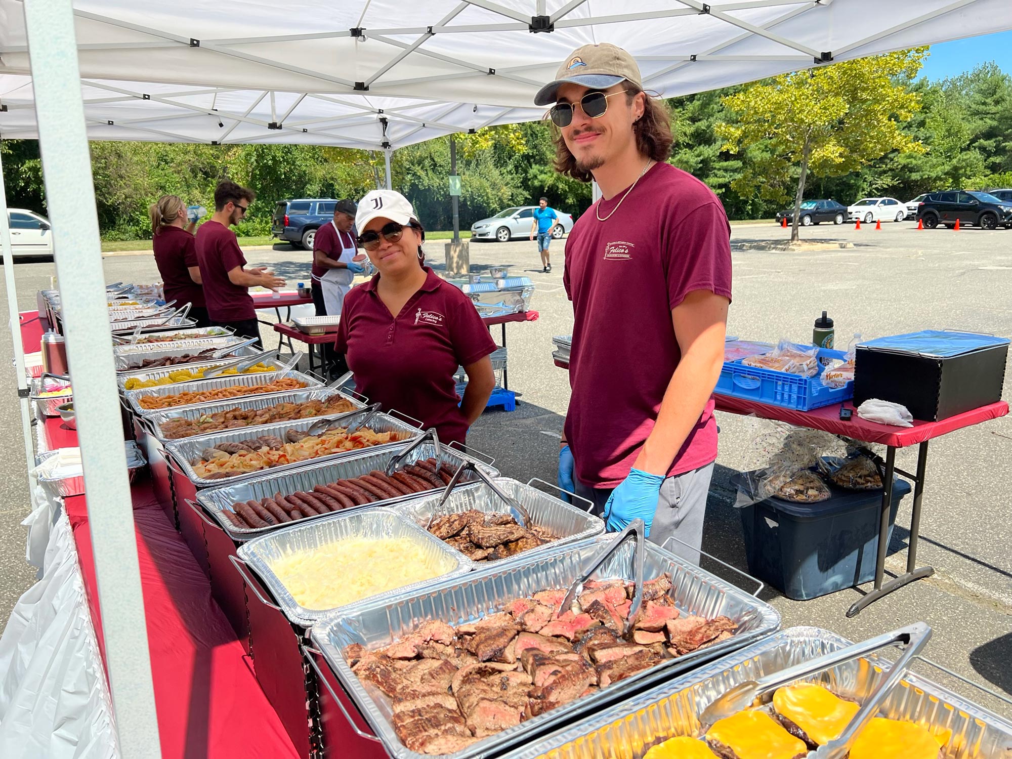 Flat-lay of people having barbeque party with meat and vegetables
